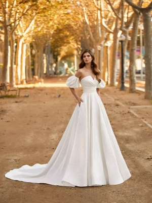 Robe de mariée Tunan avec manches bouffantes, élégance classique et moderne